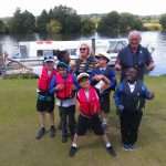 children and volunteer by river at Bisham abbbey